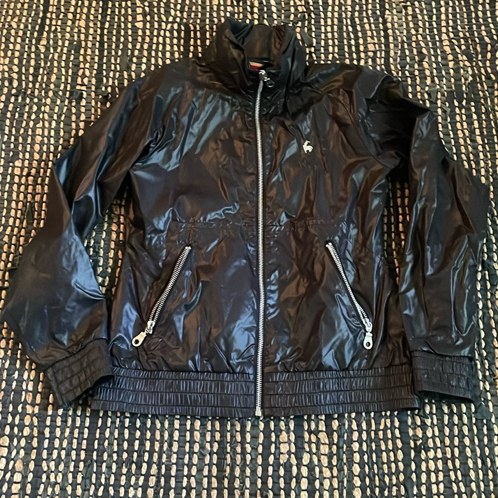 Vintage Le Coq Sportif black windbreaker with attached hidden hood Pristine